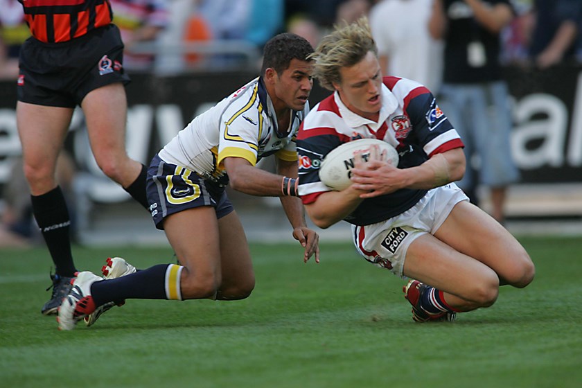 On the Board: Roosters centre Ryan Cross touches down early on, beating out Cowboys fullback Matt Bowen to the line. 