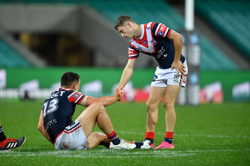 Through thick and thin: Walker helps Radley from the ground after a loss in 2021. 